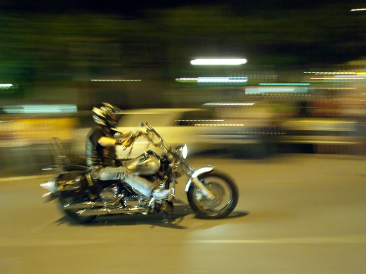 a motorcycle rider is making it's way down the road