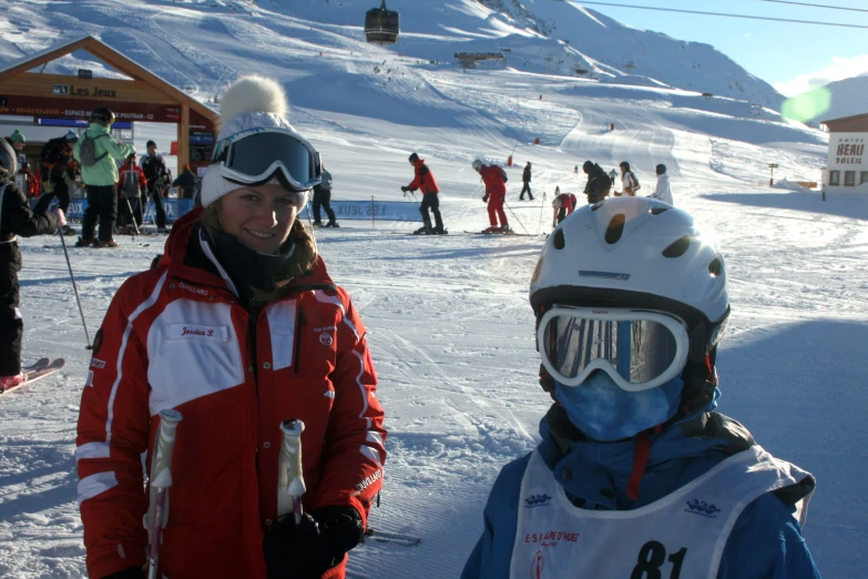 two people on snow skies are in the snow