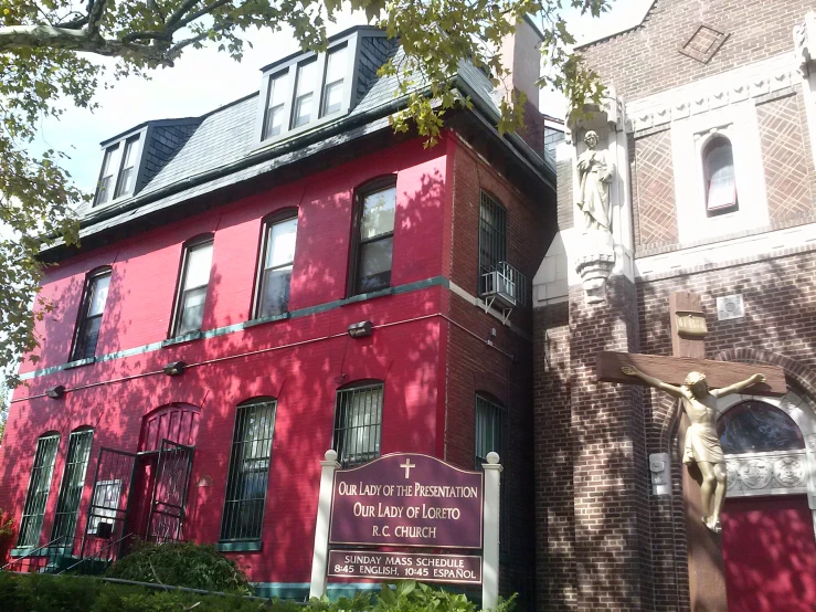 a couple of large red buildings sitting next to each other