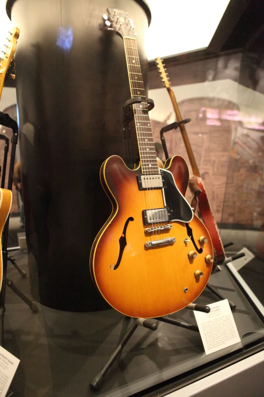 guitars that are on display in a case