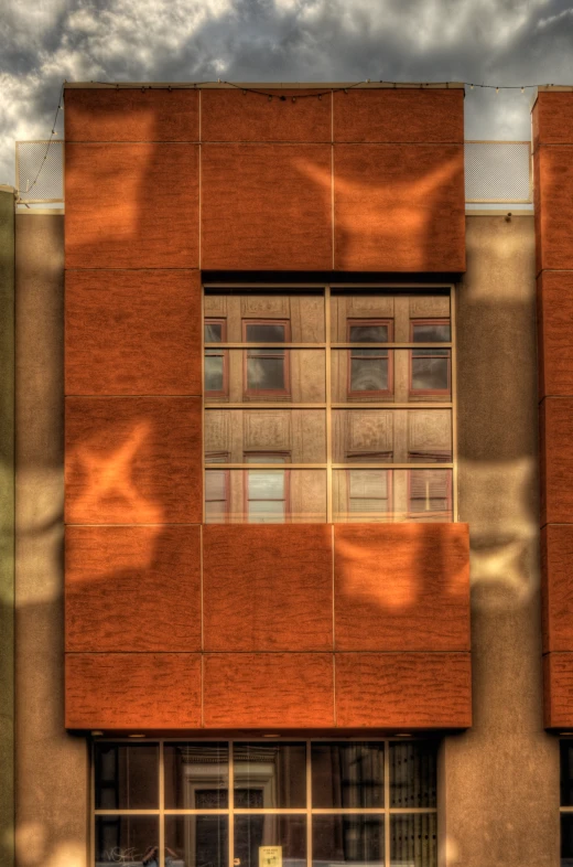 a red brick building with a window on the front