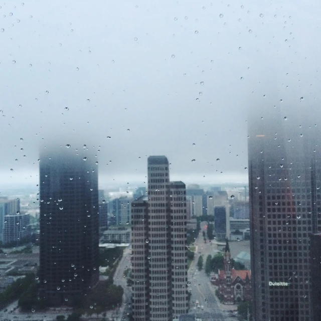 cityscape from the window of a skyscr in foggy weather