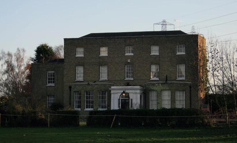 a brick building with large windows on the side