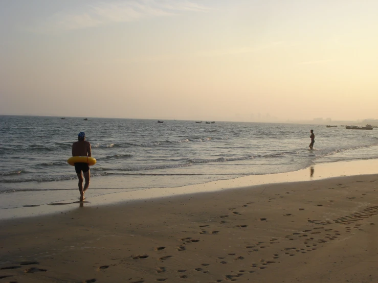 people are at the beach looking out into the water