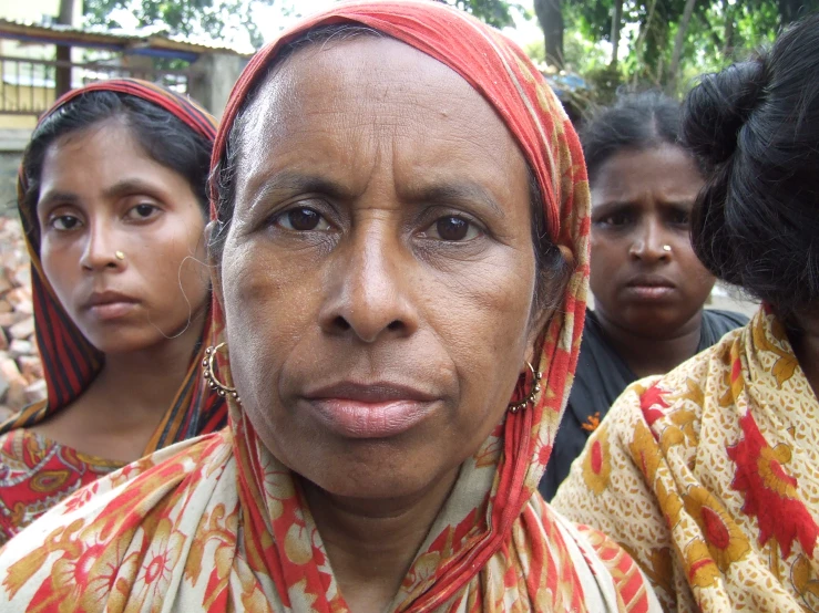 two women are staring and the others have a crowd behind them