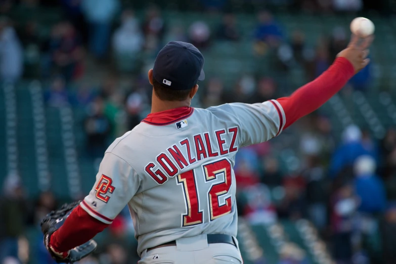 a baseball player throwing a pitch at a game