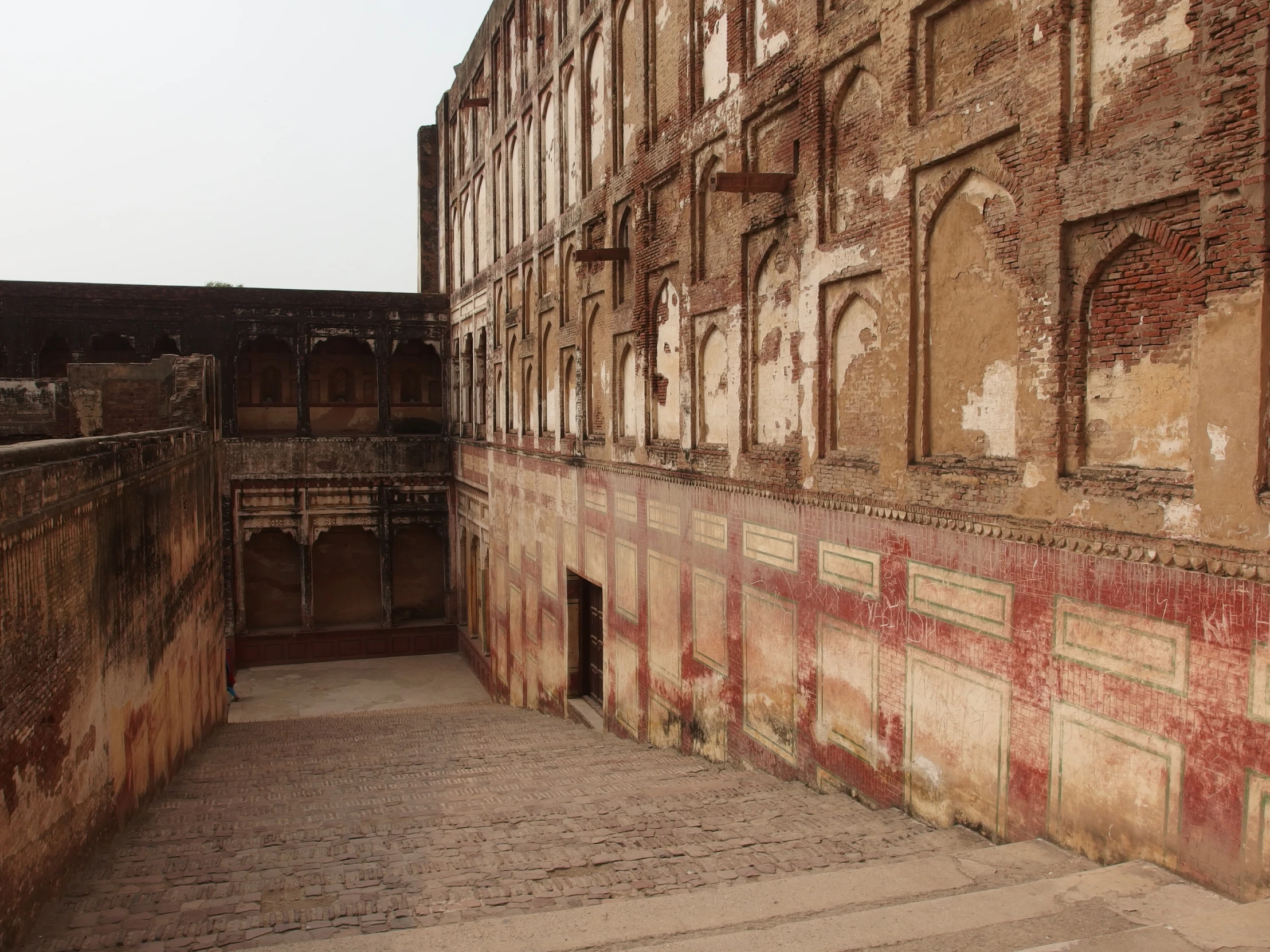 an old building with a courtyard in front of it