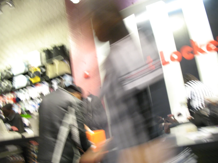 blurry pograph of man in an office with people behind
