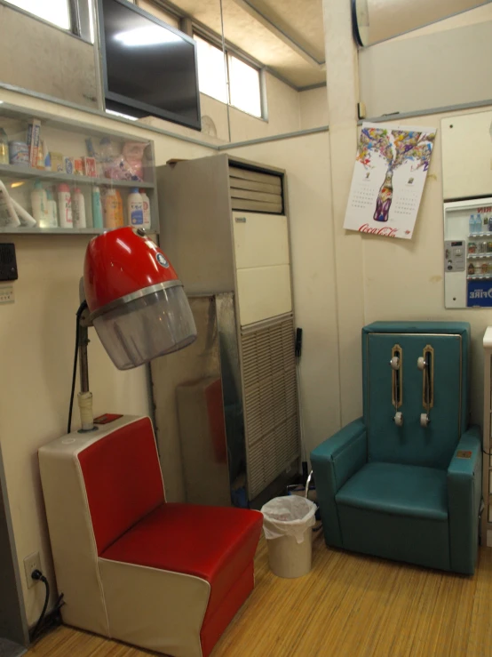 a blue chair and a red chair in the room