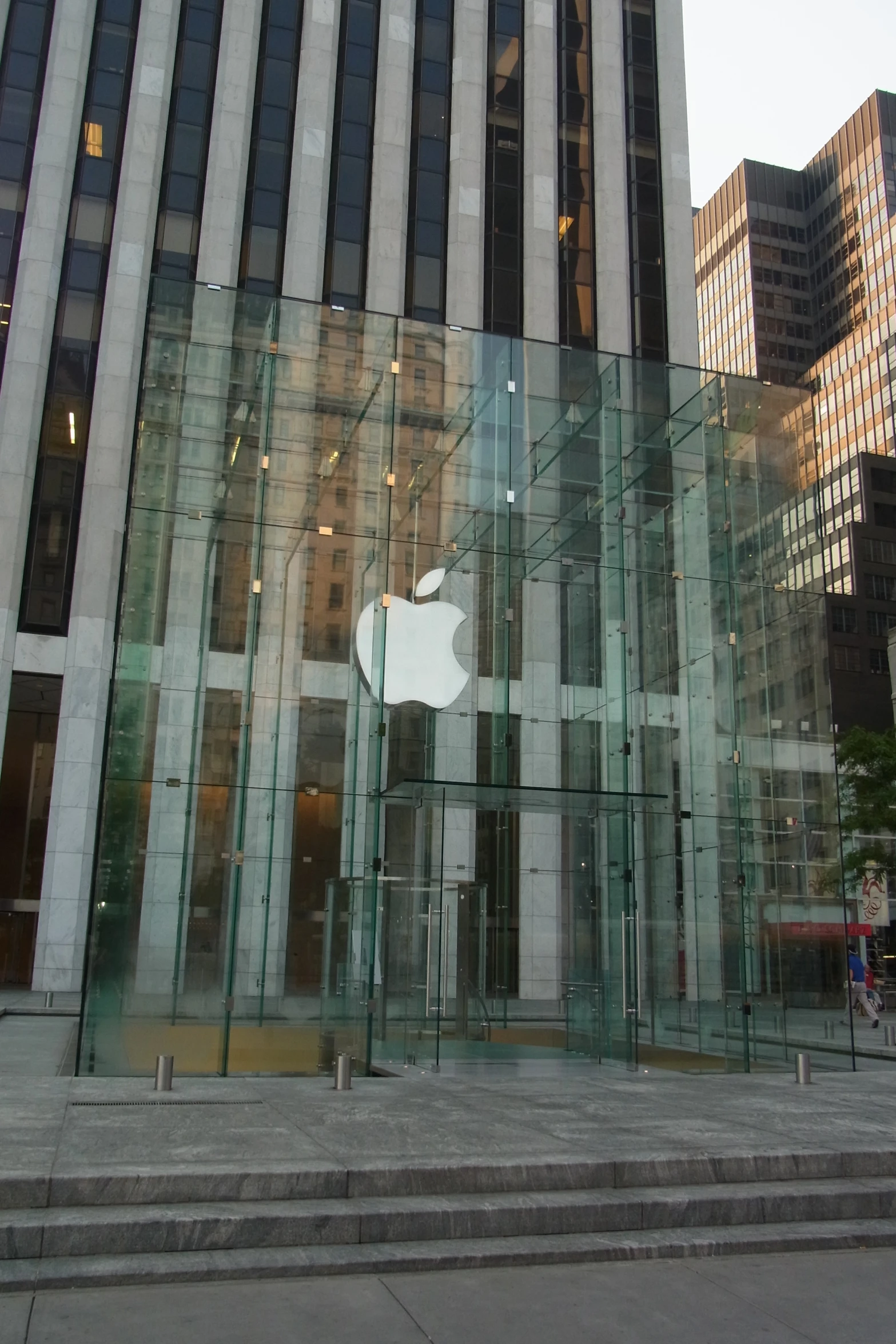 an apple store is displayed inside of the glass structure