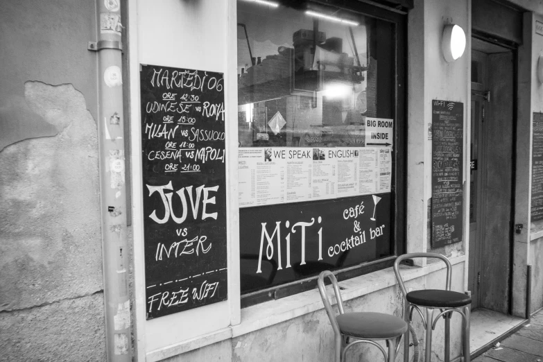 a black and white po of chalkboard writing on the window