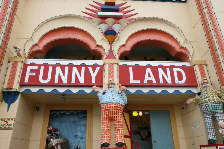 the front entrance of an establishment with dummy clowns