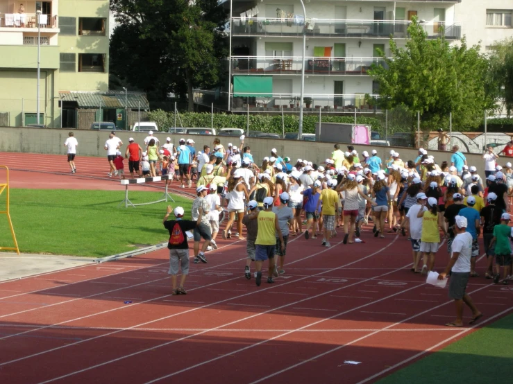 young athletes line up on an outdoor track