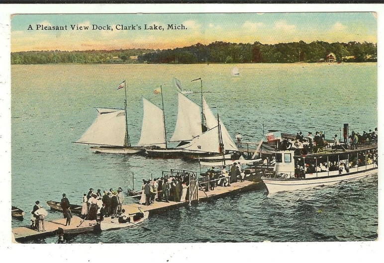 a boat and small sailboat are out in the water