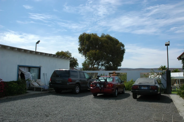 a car park area with a building in the background