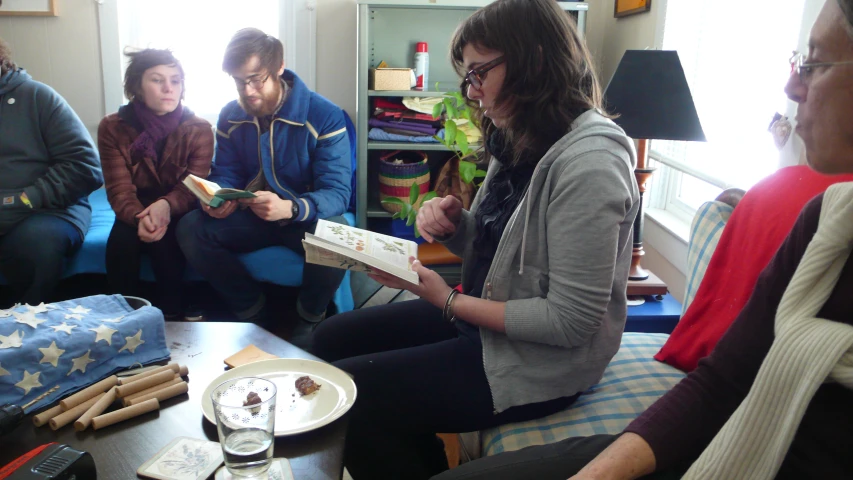 a group of people sitting around each other