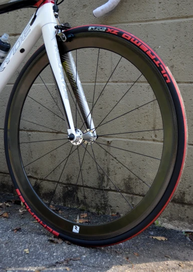 a bike tire with a white and red rim