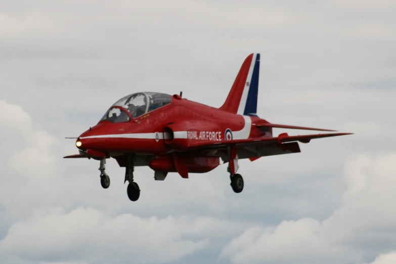 an air plane flying with a landing gear down