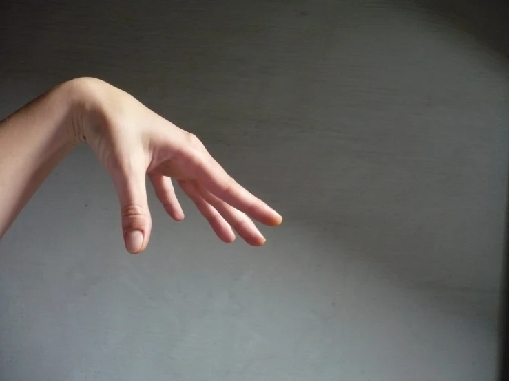a close up of a persons hand reaching for soing