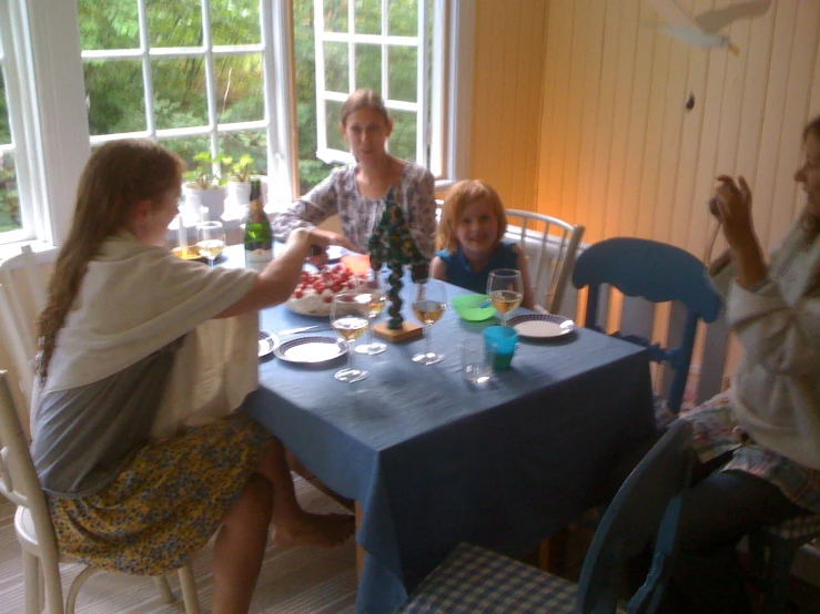 a family having dinner together at the table