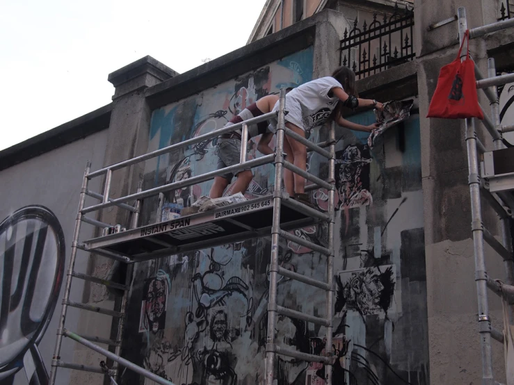 an outdoor space is being cleaned with graffiti
