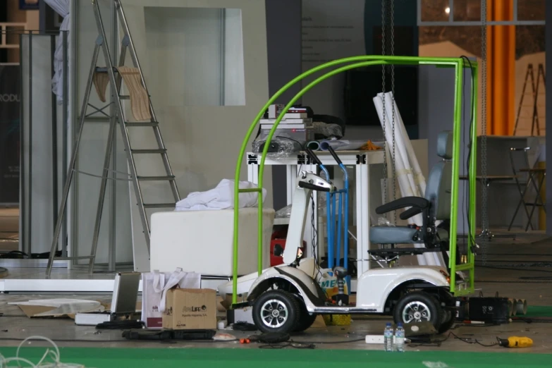 a fork lift that is on display on the side of a building