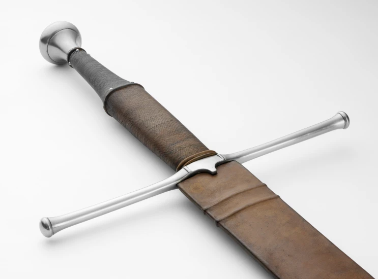 the metal handle on the blade is mounted on wood and is a fine replica of a sword