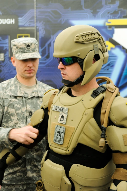 man wearing an army uniform, glasses, and helmet