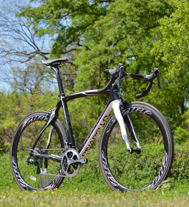 an unusual bicycle parked in the middle of a field