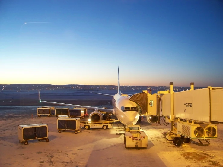 a plane is next to the cargo truck