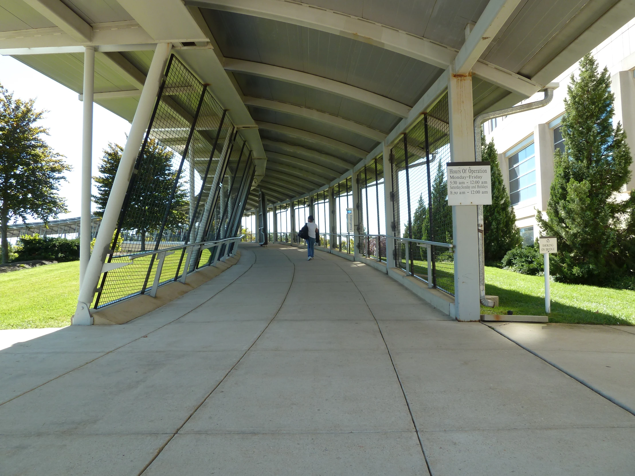 a walkway with a metal railing over it