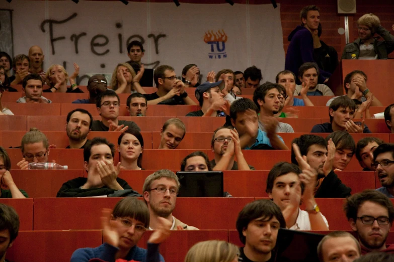 large audience in the auditorium waiting for a lecture