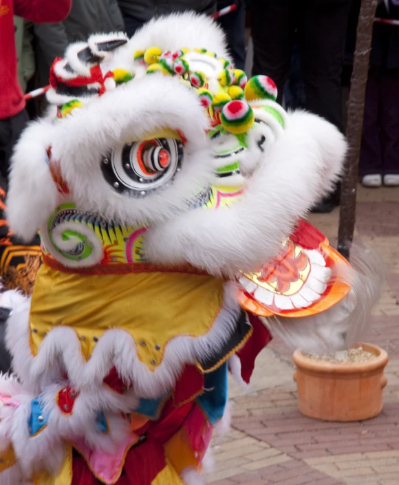 a close up of a lion in a costume