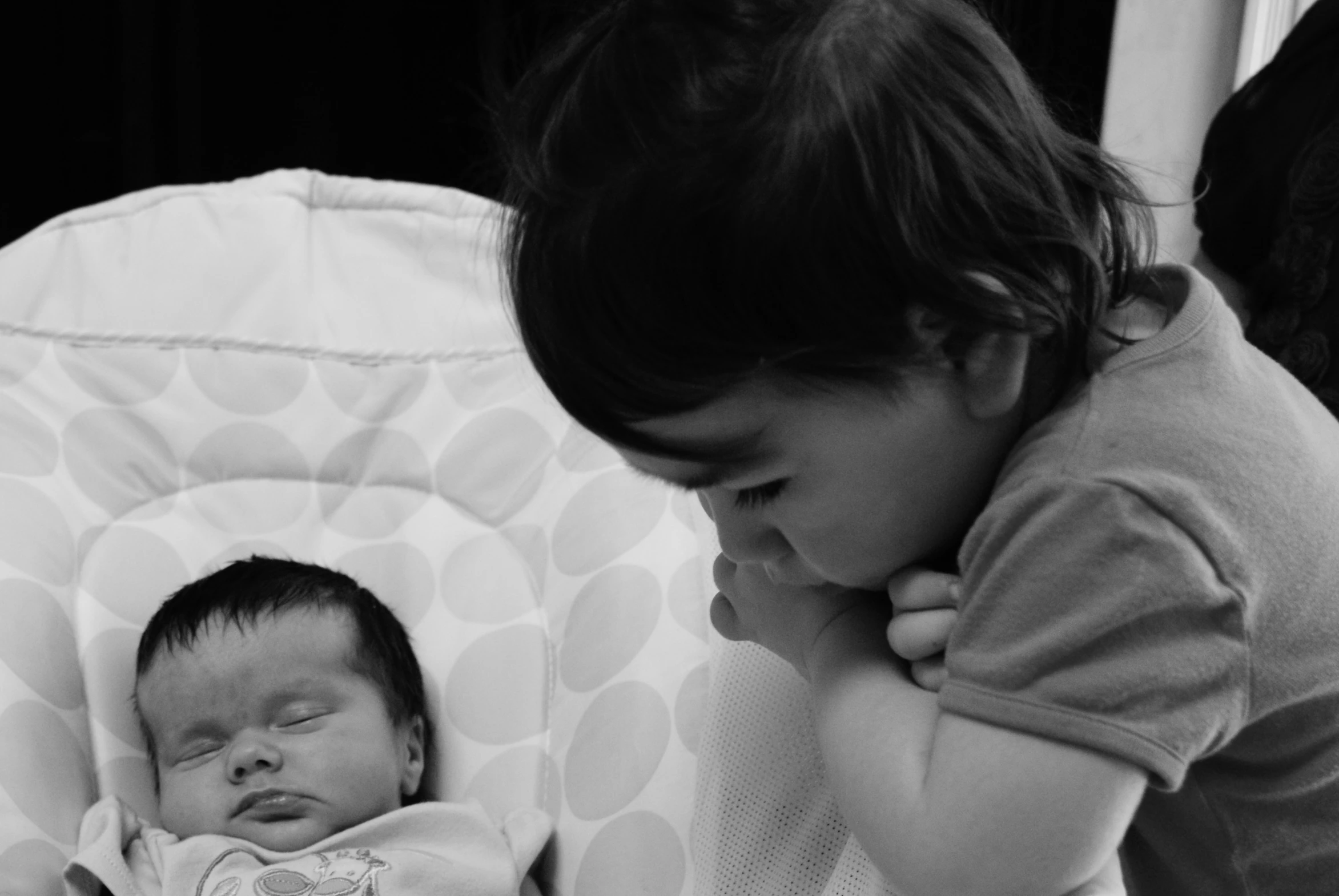 black and white pograph of a woman holding a baby