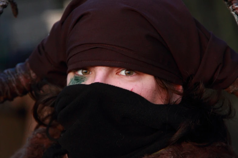 the woman has a black scarf around her head