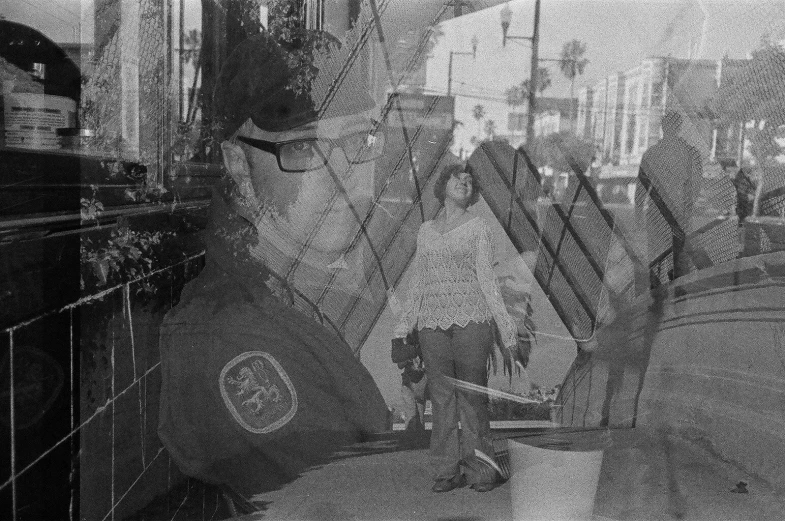 a reflection of an eagle is shown in the windows of a shop