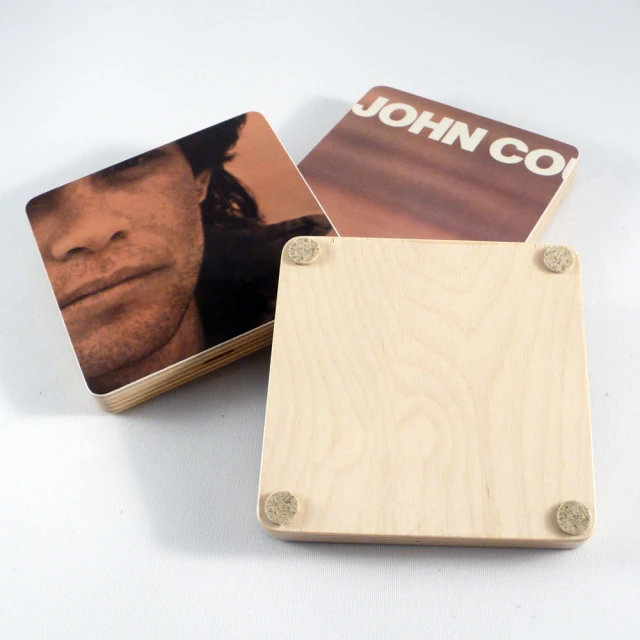 square shaped wooden coaster with magnets on them