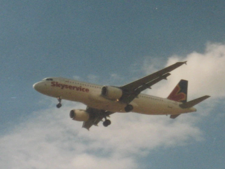 a commercial airliner flies through the sky