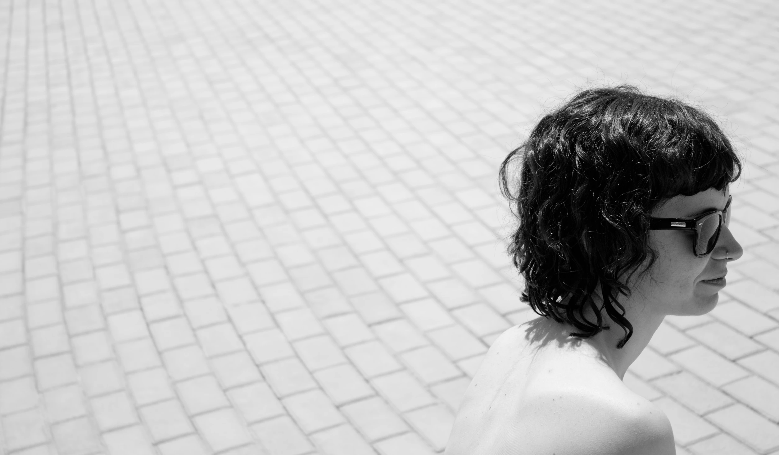 black and white pograph of a woman on a skateboard