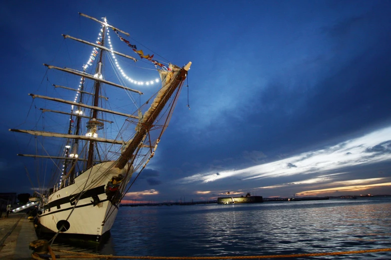 a very old ship that is on the water