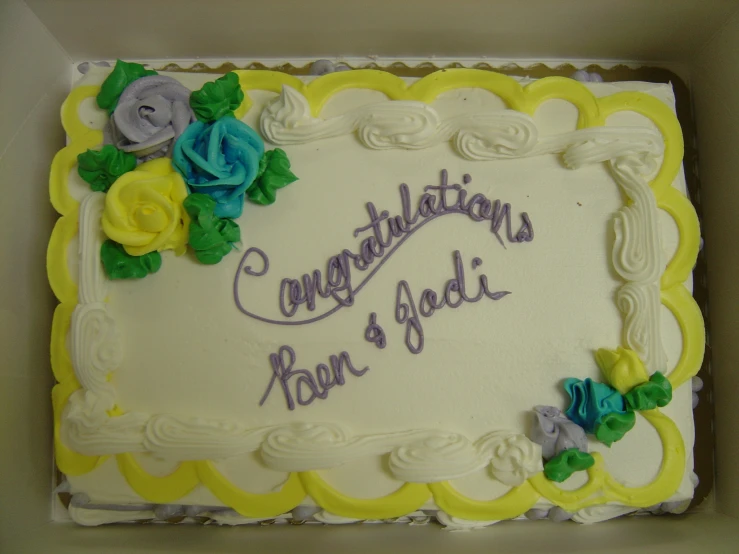 a cake is presented with a congratulations message