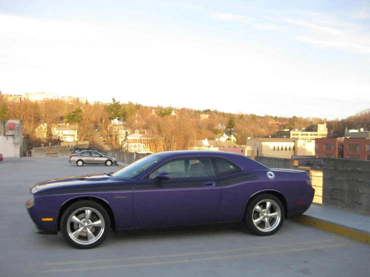 a purple car is parked in a parking lot