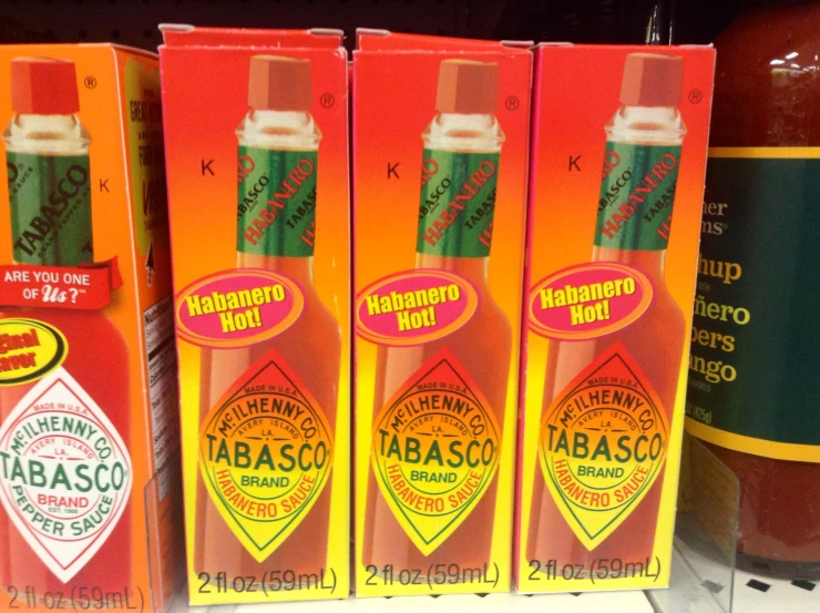 a close up of 3 tubes of tabasco