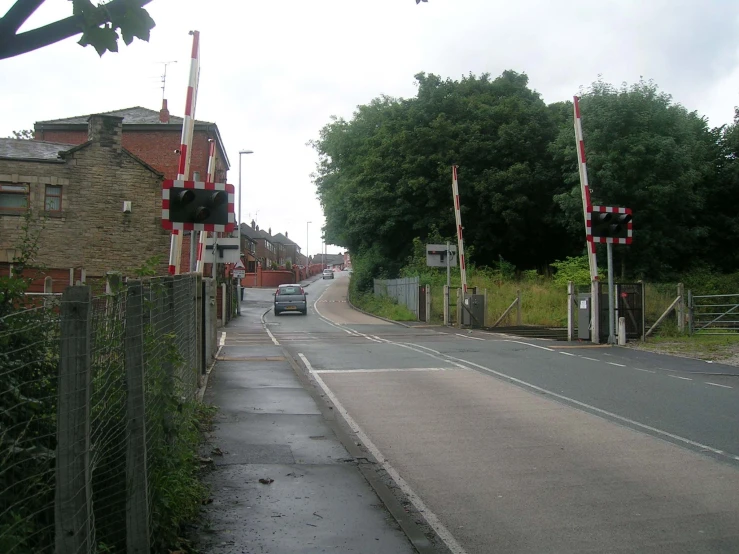 the road runs down the center of a neighborhood