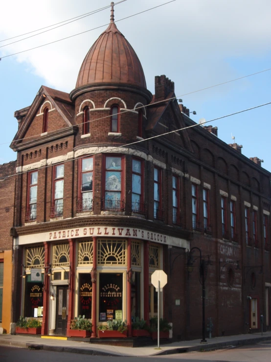 an old building with large ornate windows and a domed top