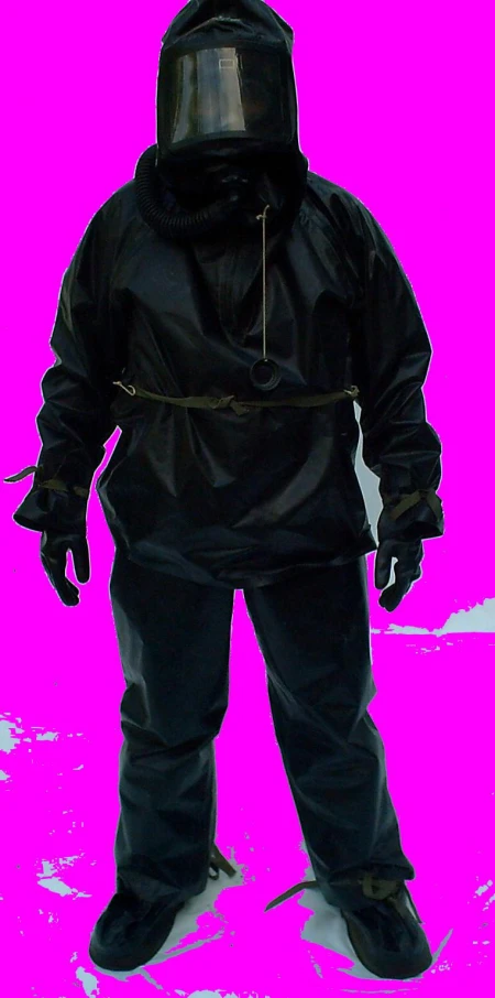 a person in black snow gear is on a pink background