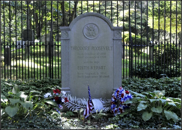 a large memorial is located behind a fence