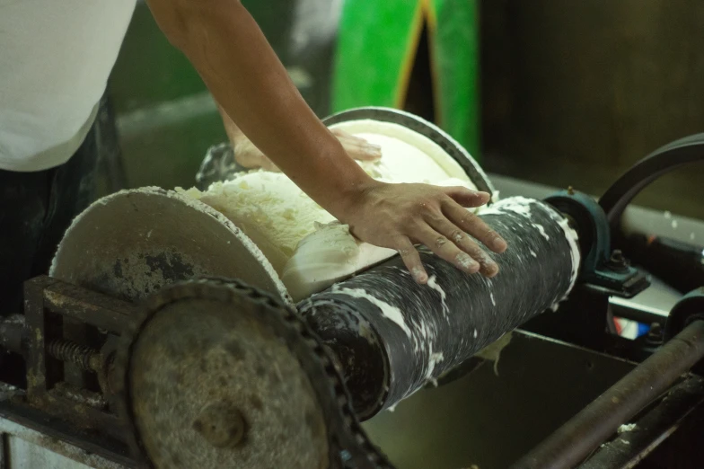 a close - up of a person wrapping up items