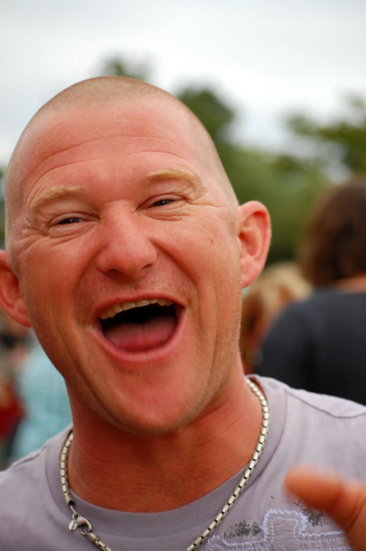 an excited man is taking a selfie with his phone