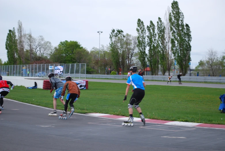 a group of skateboarders riding on their skate boards